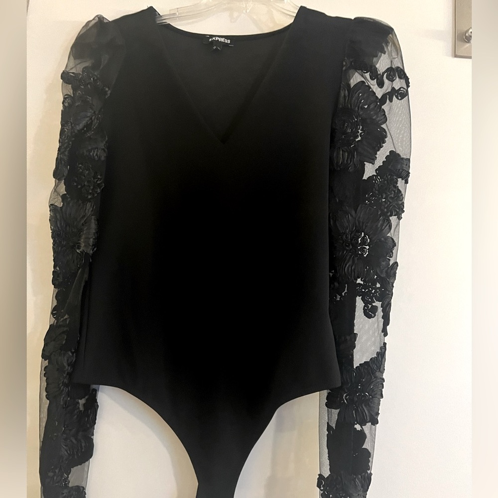 Gently used - Express lace black bodysuit. Size medium.
